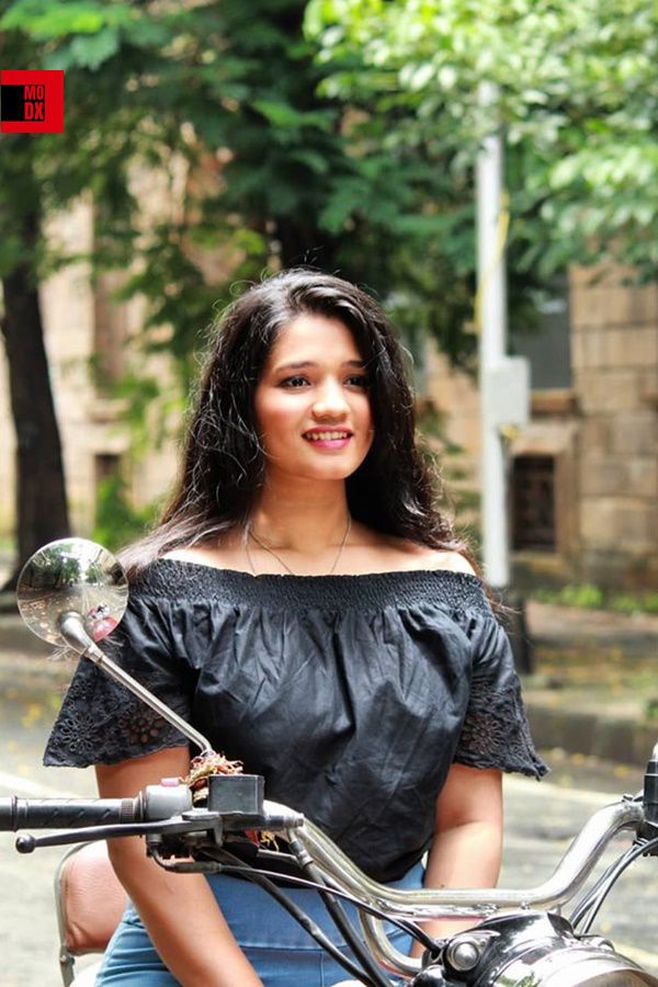 mumbai girl sitting on bike