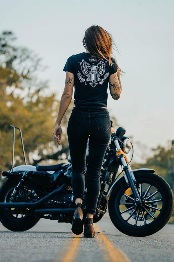 girl walking towards motorcycle